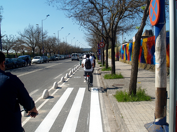 Half-wheel bollards in Seville separate the cycle lane from the road, giving the cyclists protection from careless drivers.